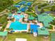 Aerial view of the community pool with swimming lanes, a splash pad, and surrounding amenities at 18941 Twinberry Dr, Tampa, FL 33647