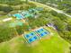 Aerial view of the community with lush landscaping, pools, tennis courts, and convenient parking at 18941 Twinberry Dr, Tampa, FL 33647