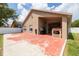 Exterior of home showcasing a large backyard with privacy fence and an outdoor patio at 18941 Twinberry Dr, Tampa, FL 33647