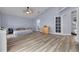Spacious bedroom with vaulted ceilings, ceiling fan, and double french doors at 18941 Twinberry Dr, Tampa, FL 33647