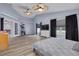 Spacious bedroom featuring vaulted ceilings, ceiling fans, and views of the property at 18941 Twinberry Dr, Tampa, FL 33647