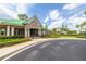 Community clubhouse featuring an attractive portico, well-kept landscaping, and ample parking at 18941 Twinberry Dr, Tampa, FL 33647