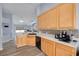 Bright kitchen featuring wood cabinets, stainless steel appliances and light countertops at 18941 Twinberry Dr, Tampa, FL 33647