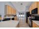 Bright kitchen featuring wood cabinets, stainless steel appliances, and eat in dining area with bay windows at 18941 Twinberry Dr, Tampa, FL 33647
