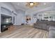 Spacious living room with wood floors, neutral paint, ceiling fan and open layout at 18941 Twinberry Dr, Tampa, FL 33647