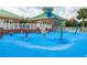 Community splash pad with colorful water features for Gathering fun at 18941 Twinberry Dr, Tampa, FL 33647