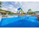 Bright community splash pad with water features and poolside views perfect for Gathering enjoyment at 18941 Twinberry Dr, Tampa, FL 33647