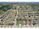 Expansive aerial view showcasing neighborhood, homes, and community layout at 13365 Chesapeake Pl, Spring Hill, FL 34609