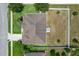 Birds eye view of home showing roof, landscaping, and fenced yard at 13365 Chesapeake Pl, Spring Hill, FL 34609