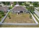 Aerial view of a fenced property featuring a spacious backyard and meticulously maintained landscaping at 13365 Chesapeake Pl, Spring Hill, FL 34609