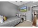 Relaxing bedroom with a comfortable bed, TV, and stylish decor at 13365 Chesapeake Pl, Spring Hill, FL 34609