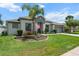 Inviting front exterior with lush lawn and decorative landscaping at 13365 Chesapeake Pl, Spring Hill, FL 34609