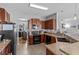 This spacious kitchen features dark wood cabinets, granite countertops, and stainless steel appliances at 13365 Chesapeake Pl, Spring Hill, FL 34609