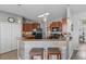 Open kitchen with counter seating and stainless steel appliances at 13365 Chesapeake Pl, Spring Hill, FL 34609