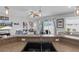 Open concept living and kitchen space with natural light and views of the backyard at 13365 Chesapeake Pl, Spring Hill, FL 34609