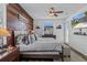 Relaxing main bedroom featuring a wood accent wall, comfortable bed, and modern amenities at 13365 Chesapeake Pl, Spring Hill, FL 34609