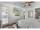 Bright main bedroom with modern furnishings, TV, and access to the outside at 13365 Chesapeake Pl, Spring Hill, FL 34609