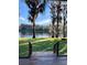 Beautiful backyard view of lake, mature trees draped with spanish moss from the deck at 18101 Boy Scout Rd, Odessa, FL 33556