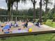 Lakefront backyard featuring a large deck area perfect for activities like yoga at 18101 Boy Scout Rd, Odessa, FL 33556