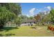 Beautiful home exterior showing the backyard and the lake at 18101 Boy Scout Rd, Odessa, FL 33556