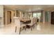 Elegant dining room with a large window and a modern dining set creates a welcoming space for entertaining at 18101 Boy Scout Rd, Odessa, FL 33556