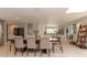 Spacious dining room with an open floor plan, tile floors, and neutral decor and modern lighting at 18101 Boy Scout Rd, Odessa, FL 33556