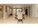Bright dining room features large wooden table and chairs and neutral decor with tile flooring at 18101 Boy Scout Rd, Odessa, FL 33556