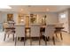 Open dining room with large wooden table and chairs, neutral decor and lots of natural light at 18101 Boy Scout Rd, Odessa, FL 33556