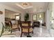 Cozy living area with comfortable seating and a view of the outdoors, seamlessly connecting indoor and outdoor spaces at 18101 Boy Scout Rd, Odessa, FL 33556