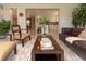 Bright, open-concept living room featuring stylish decor, comfortable seating, and an inviting atmosphere at 18101 Boy Scout Rd, Odessa, FL 33556