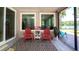 This is a view of the screened in patio with a sign and view of the lake at 18101 Boy Scout Rd, Odessa, FL 33556