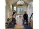 A yoga studio with hardwood floors and natural light provides the perfect serene space for exercise and relaxation at 18101 Boy Scout Rd, Odessa, FL 33556