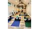 A large studio with hardwood floors and natural light creates a versatile space for wellness or creative endeavors at 18101 Boy Scout Rd, Odessa, FL 33556