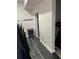 Unfinished basement with new paint, concrete floor, and access to outside at 2518 Sunset Ln, Lutz, FL 33559