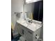 Bathroom vanity featuring marble countertops, and black hardware at 2518 Sunset Ln, Lutz, FL 33559