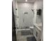 Modern bathroom with glass enclosed shower and sleek vanity at 2518 Sunset Ln, Lutz, FL 33559
