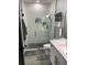 Bathroom showcasing glass shower, modern vanity, and fixtures at 2518 Sunset Ln, Lutz, FL 33559