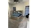 Cozy bedroom with a ceiling fan, carpet, curtains and a modern design at 2518 Sunset Ln, Lutz, FL 33559