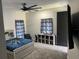 Nicely decorated bedroom with carpet, a ceiling fan, curtains and a modern design at 2518 Sunset Ln, Lutz, FL 33559