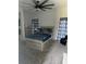 Nice bedroom with a ceiling fan, carpet, curtains and a modern design at 2518 Sunset Ln, Lutz, FL 33559