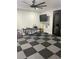 Bonus room with checkerboard floors, ceiling fan, and tv at 2518 Sunset Ln, Lutz, FL 33559