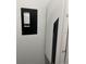 A close-up of an electrical panel and a Lutron device, showcasing modern home automation and power management at 2518 Sunset Ln, Lutz, FL 33559