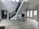 Spacious foyer with a grand staircase, high ceilings and lots of natural light at 2518 Sunset Ln, Lutz, FL 33559