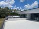 Modern home with an expansive roof deck, perfect for entertaining and enjoying panoramic views at 2518 Sunset Ln, Lutz, FL 33559