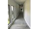 Bright hallway with wood floors and lots of natural light at 2518 Sunset Ln, Lutz, FL 33559