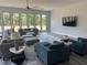 Expansive living room with comfortable seating, large windows and stylish decor at 2518 Sunset Ln, Lutz, FL 33559