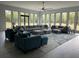 The massive living room features plenty of comfortable seating and natural light at 2518 Sunset Ln, Lutz, FL 33559