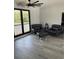 Sitting area with leather chairs, modern floors and big windows at 2518 Sunset Ln, Lutz, FL 33559