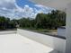Expansive roof deck with scenic views of the marsh and trees, perfect for relaxation and outdoor enjoyment at 2518 Sunset Ln, Lutz, FL 33559