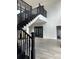 Beautiful stairway with black railings and plenty of natural light at 2518 Sunset Ln, Lutz, FL 33559